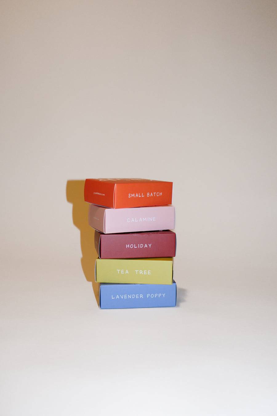 Stack of colorful boxes with labels on a light background